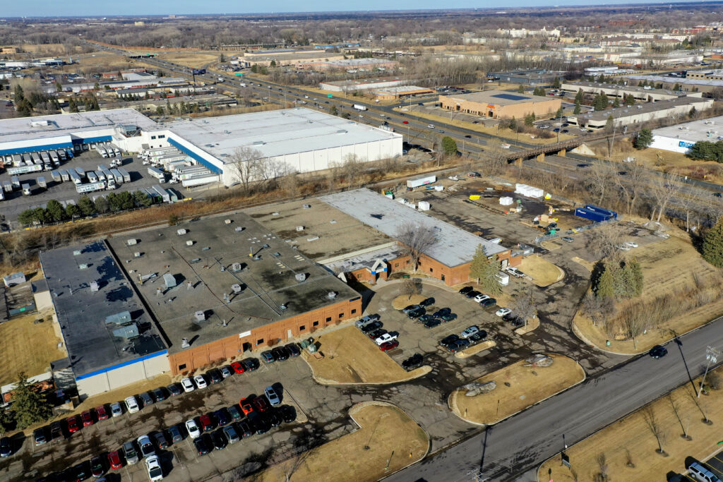 Knowledge Computers A drone shot of Knowledge Computers home office in Plymouth, Minnesota. A few hundred feet in the sky you can see highway 494 on the upper right and the building in the middle.