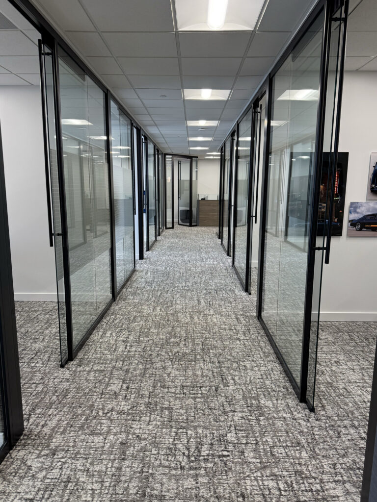 Signature Wealth Management Signature Wealth Management hallway with glass walls that are for office.
