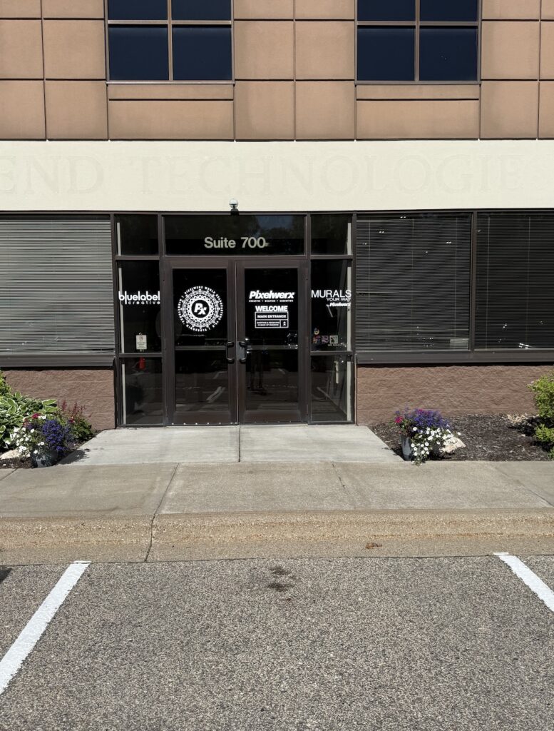 Screenshot Main entrance to a professional commercial office building featuring Suite 700 with direct access from the parking lot.